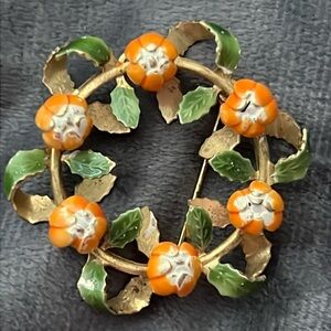 VINTAGE ZINK BROOCH WITH NATURAL STONE ORANGE FLOWERS & GREEN ENAMAL LEAVES.